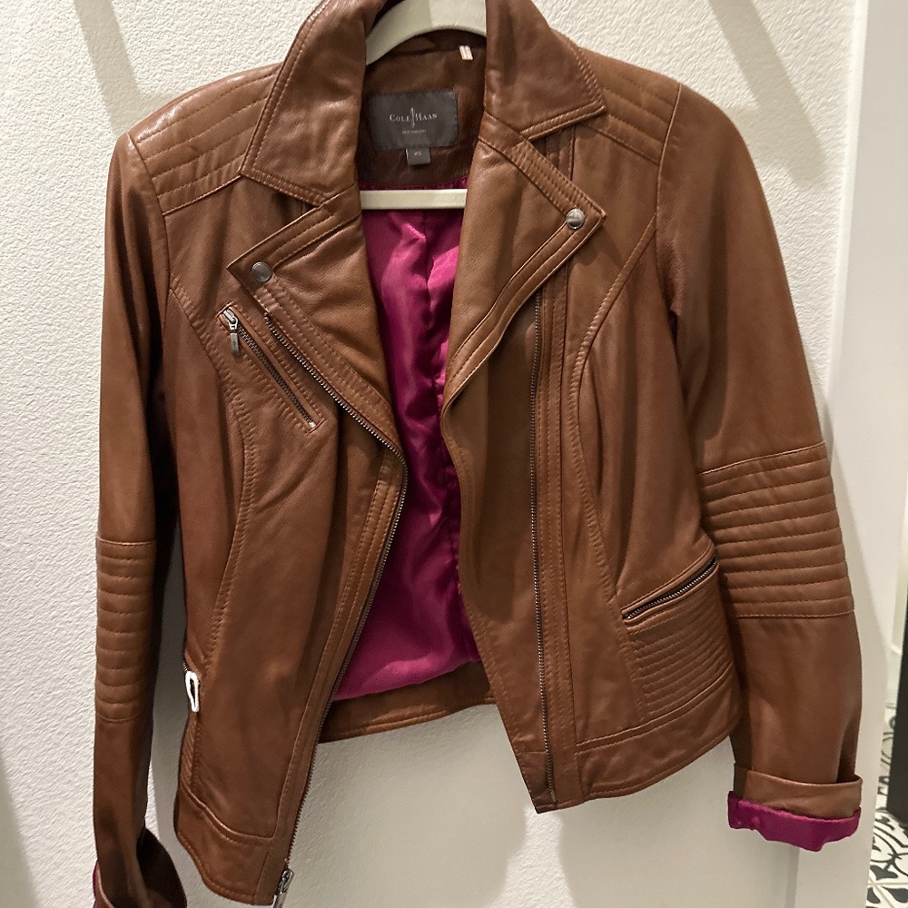 Cole ham leather jacket. Worn twice. cognac color.  Zipper pockets motto style